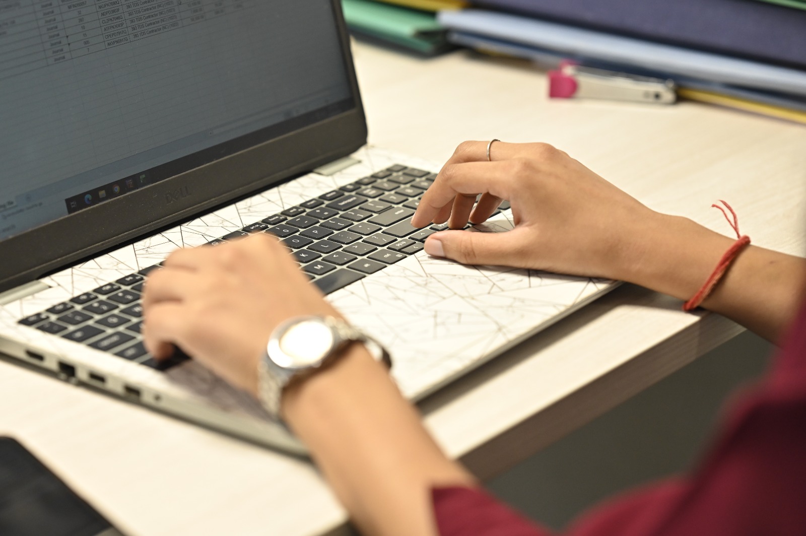 A V. V. Kale associate working through a client ledger